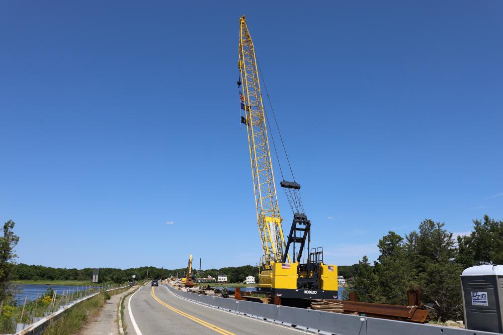 Stationary construction vehicles sit at the Route 6 bridge construction site. Photo by Nick Mossman