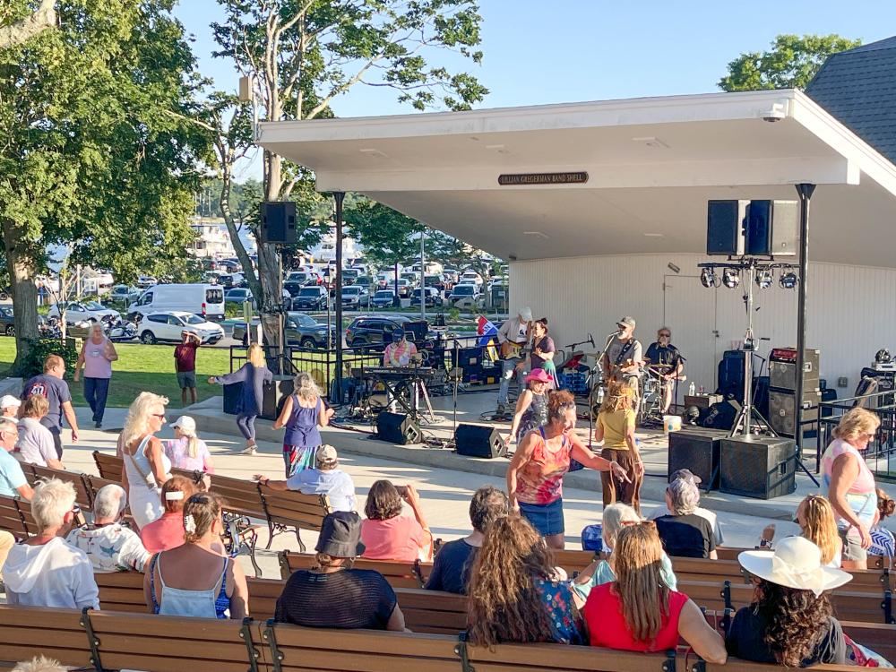 Fans dance in front of the Lillian Gregerman Bandshell during Violin River's performance. Photo by Christian Uva
