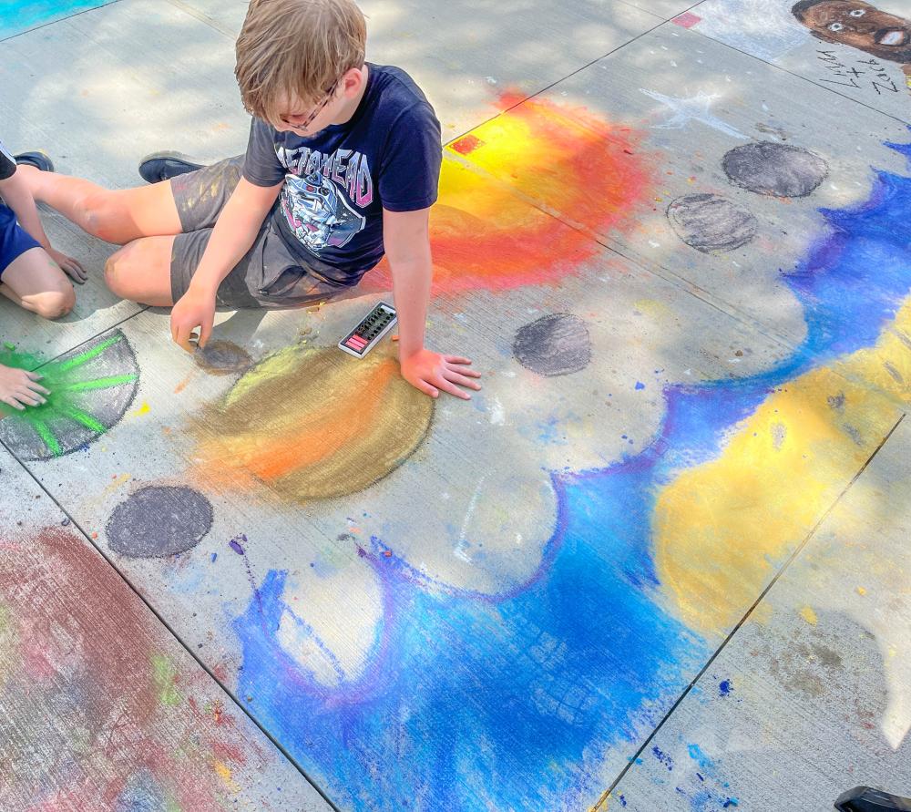 Ender, 12, made a night sky design with his friend Luca, 8. Photo by Christian Uva