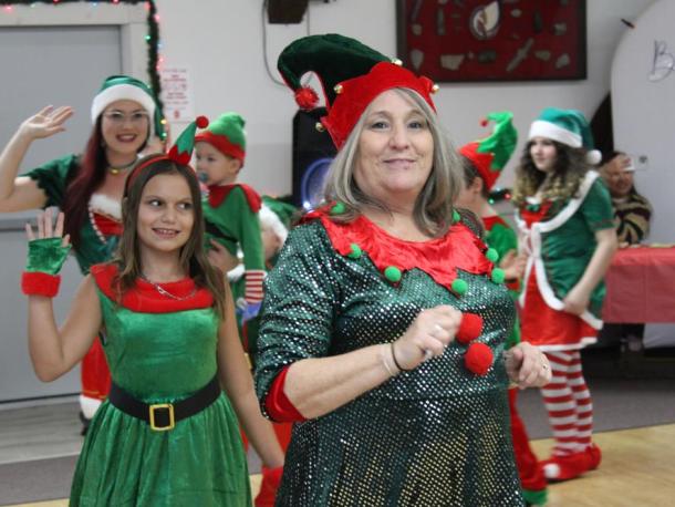 Elizabeth Wingert leads the elf parade. Photos by Brandy Muz