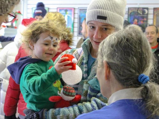 Morgan Sousa gets a new ornament. Photos by Brandy Muz