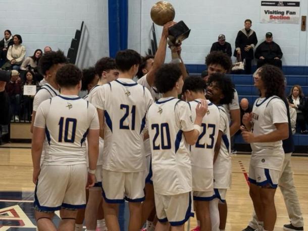 The team celebrates with their trophy. Photos source: Wareham High School