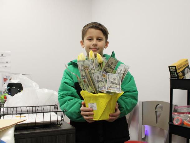 Will Boucher and his bouquet of $100 bills. Photos by Brandy Muz