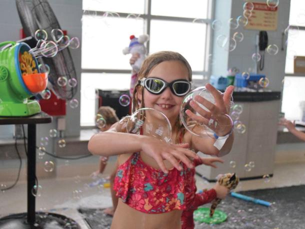 Grace, 7, shows off some bubbles she caught. Photos by Kat Sheridan