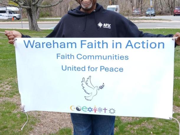 Wareham Faith and Action member beams with a banner. Photos source: Nancy Cushman Rice