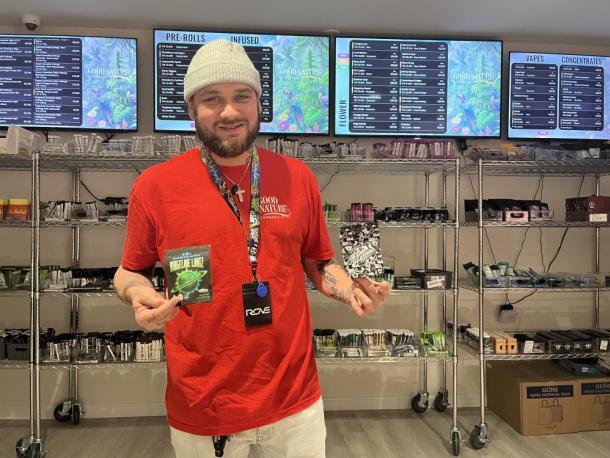Jose Lemos poses with some of the shops new product. Photos by Brandy Muz