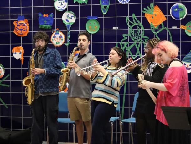Wareham alumna Sophia Maniglia, center, performs with other students and music teacher Jason Roth, to her left. Photos by Nick Mossman