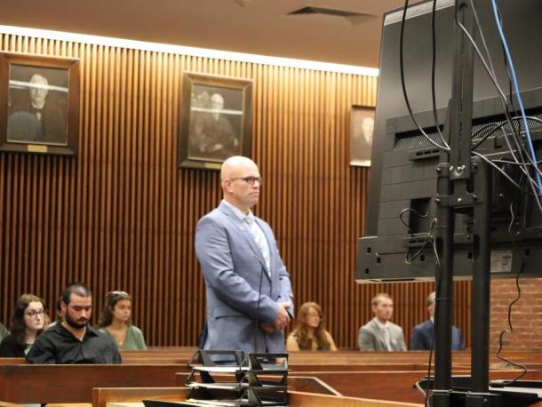 Selectman Jared Chadwick stands in a courtroom on Thursday, July 9, before separate charges from earlier this year were dismissed. Photo by Nick Mossman