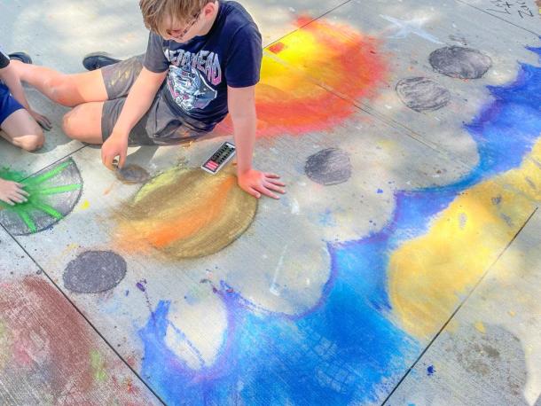 Ender, 12, made a night sky design with his friend Luca, 8. Photo by Christian Uva