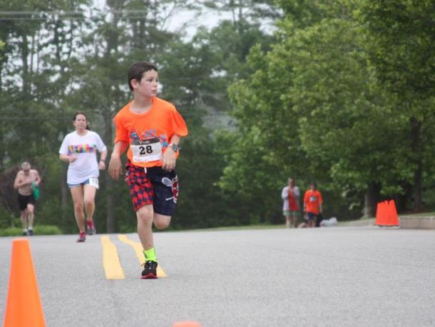 Noah Brilliant of Plymouth approaches the finish line in the 2017 Lazy Lobster Road Race. Photo by Matthew Bernat