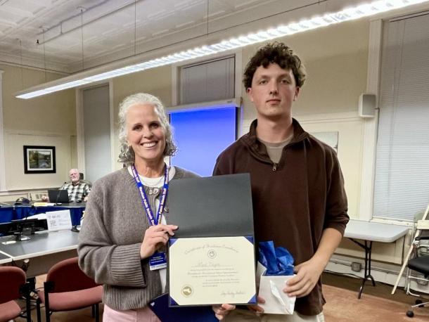 Superintendent Amy Hartley-Matteson presents Wareham High School senior Mark Deyoe with the Massachusetts Association of School Superintendents Certificate of Academic Excellence during the School Committee's Oct. 29 meeting. Photo by Erin Darling