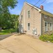 Side of 17 Beeden Road with the paved driveway and side entrance, Westport, MA