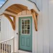 Teal entry door under a curved cedar front portico at 226 Sanford Road, Westport, MA