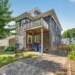 Rear of 370 Maple Street with a second-floor deck and back entry, New Bedford, MA