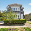 Street view of 370 Maple Street in New Bedford's West End, with its front walk and hedges