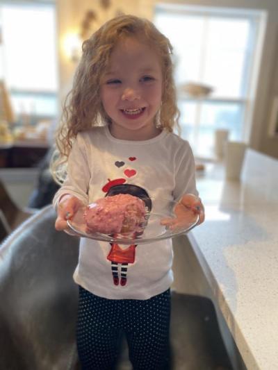 3-year-old Avaeh Richman-O’Connor holds a donut. Photo by: Ashley Lessa