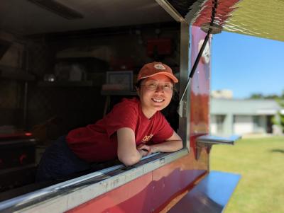 Lee leans outside her food truck.