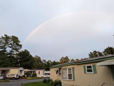 A rainbow forms over the mobile home park on Monday evening.