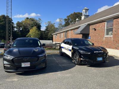 The two 2022 Ford Mustang Mach E electric cars recently purchased by the Wareham Police Department. The one on the left belongs to Lieutenant Peter Flannery. The one on the right belongs to Sergeant Daniel Flaherty.