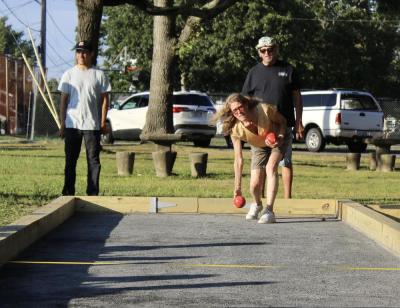 Bocce players try their hand at the game.