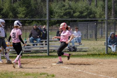Lily Garcia crosses the plate to complete an inside the park home run.