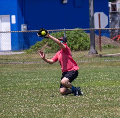 Tom Harrigan makes a sliding catch.