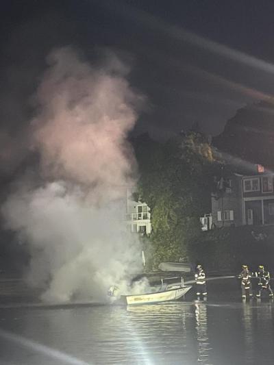 Smoke emits from the small vessel.