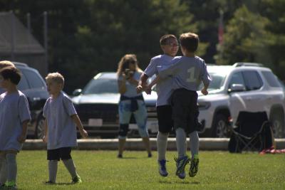Jaidell Harrison and Carter Lyons chest bump after a goal. Photos by Brandy Muz