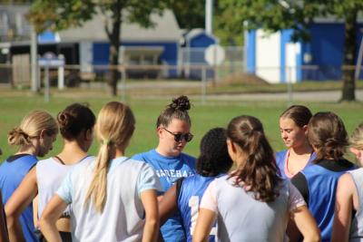 Coach speaking to players