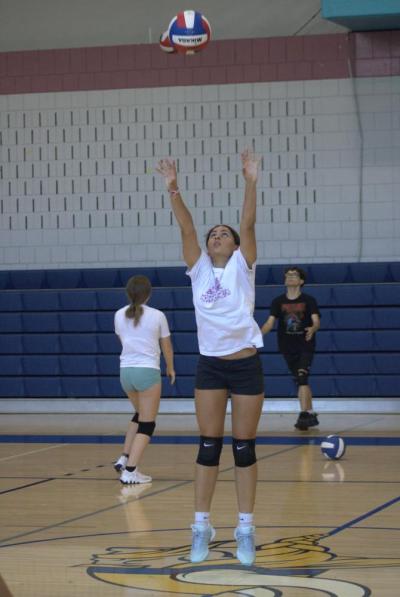 Mackenzie Via-Kashner jumps for a hit