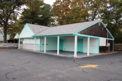 The iconic turquoise building sits empty.