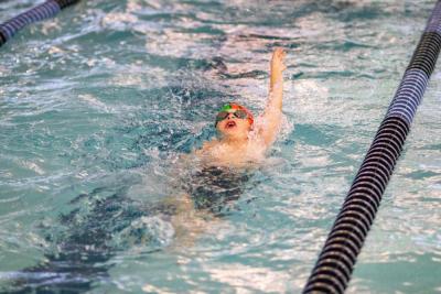 Rochester's Sam Reece, 8, works on the backstroke. none