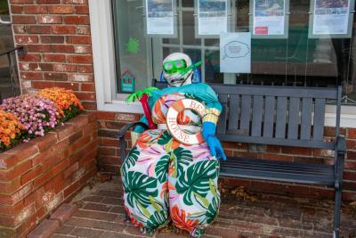 The scarecrow outside of Jack Conway Realty is less ready to scare birds and more ready for the beach. none