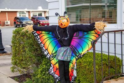 The scarecrow outside of Ready, Kiernan and McNally Attorney at Law on Main Street is ready to fly like a butterfly. none