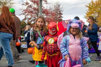 From left: Nora, 7, Lucas, 4, and Elise, 4, were some of the last trunk-or-treaters to head home. none