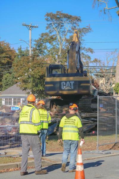Wareham Municipal Maintenance looks on into the demo. Photo by Brandy Muz Wareham Municipal Maintenance looks on into the demo. Photo by Brandy Muz