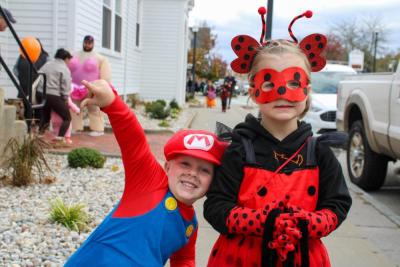 Clayton and Genevieve Schmoker gather candy in style.