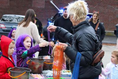 The Wareham Village Association hands out beads.