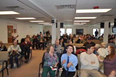 Members gather inside for the first time.