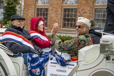 Former Grand Marshall Julio Roderick waves to the crowd.
