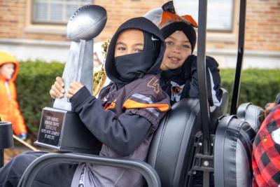 The Wareham Mites' Ryder Ahlgren shows off the teams recent Super Bowl win. 