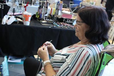 One booth works on future sale items during the fair.