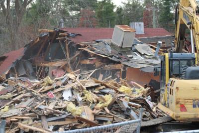 The remains of the building as demolition continues.