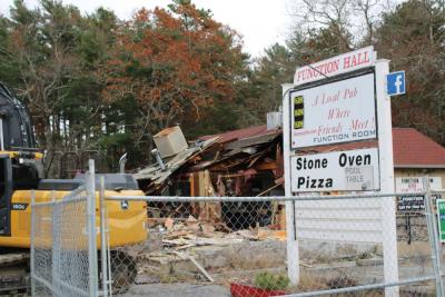 The sign for BB's Bar and Grille still stands during demolition. Photos by Brandy Muz