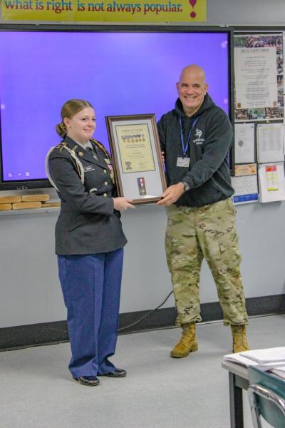 Ava poses with her award.