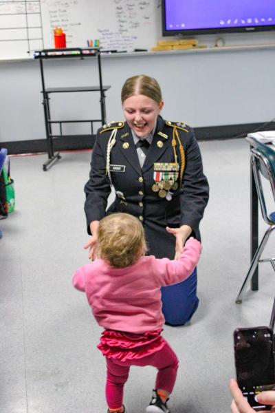 Small steps by Ava's little sister following the ceremony.