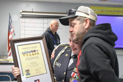 Christopher Knight hugs his daughter.