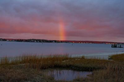 A rainbow drops in for the last few minutes of sunlight.