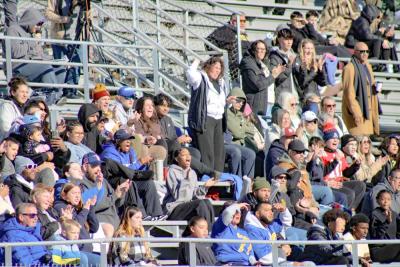 Fans hoot and holler for a touchdown.