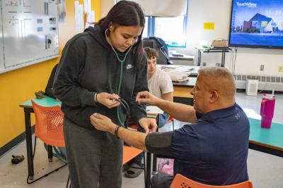 Alivia Benitez-Gaudette practices on instructor Daniel Pina. Photos by Brandy Muz